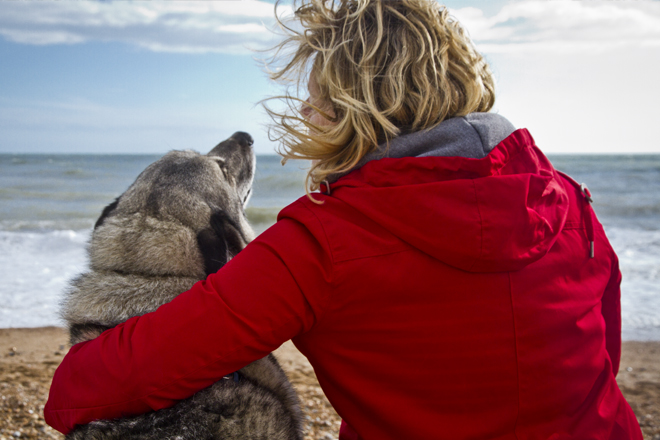 Jane snuggling with Magnus on Brighton beach